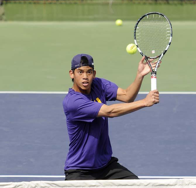 LSU sophomore Tam Trinh returns the ball Friday, March 7, 2014 during a doubles match against Alabama in W.T. "Dub" Robinson Stadium.