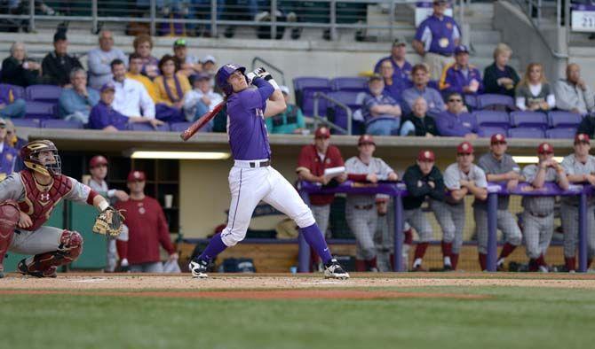 LSU senior outfielder Jared Foster (17) hits the ball during the Tigers' 16-2 victory against Boston College on Wednesday, Feb. 21, 2015 at Alex Box Stadium.