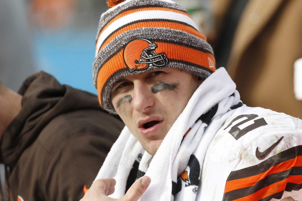 FILE - In this Sunday, Dec. 21, 2014, file photo, Cleveland Browns quarterback Johnny Manziel (2) sits on the bench during the second half of an NFL football game against the Carolina Panthers in Charlotte, N.C. An advisor for Manziel said in a statement released by the team Monday, Feb. 2, 2015, that Manziel has decided to enter treatment for an unspecified condition. (AP Photo/Bob Leverone, File)