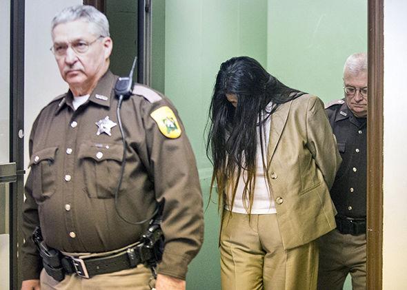 Purvi Patel is led out of the courtroom in handcuffs after being found guilty of felony neglect and feticide on Tuesday, Feb. 3, 2015, inside the St. Joseph County Courthouse in South Bend.