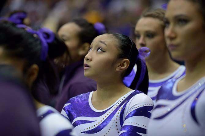 LSU freshman Erin Macadaeg watches on as her teammates take on the vault on Friday, Jan. 23, 2015, during the Lady TIger's 197-192 victory against Missouri in the Pete Maravich Assembly Center.