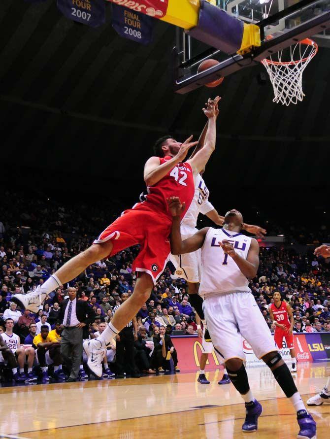 LSU sophomore guard Tim Quarterman (55), sophomore forward Jarell Martin (1) and Georgia senior forward Nemanja Djurisic (42) attempt to catch the rebound on Saturday, Jan. 10, 2015, during the Tigers' 87-84 win against the Bulldogs in the Pete Maravich Assembly Center.