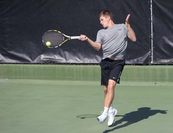 LSU senior Chirs Simpson hits the ball during the Tigers' 7-0 victory against Jackson State on Saturday, Feb. 7, 2015 at the W.T. 'Dub' Robinson Stadium.