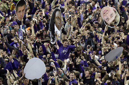 Kansas State fans celebrate victory following an NCAA college basketball game against Kansas at Bramlage Coliseum in Manhattan, Kan., Monday, Feb. 23, 2015. Kansas State defeated Kansas 70-63. (AP Photo/Orlin Wagner)