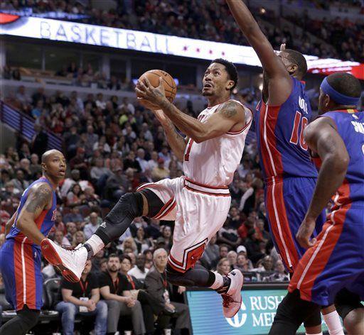 FILE - In this Nov. 10, 2014, file photo, Chicago Bulls guard Derrick Rose drives past Detroit Pistons forward Greg Monroe (10) during the second half of an NBA basketball game in Chicago. The news that Derrick Rose will have knee surgery again hit the Chicago Bulls and their fans hard and left them in a familiar spot _ trying to get by without their star point guard. The torn meniscus in his right knee was announced Tuesday night, Feb. 24, 2015, another tough twist for a franchise, a star, his sponsors and a fanbase that thought the Bulls were entering another golden era just a few years ago. (AP Photo/Charles Rex Arbogast, File)