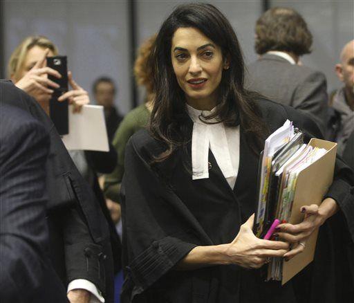 Amal Clooney, a member of a legal team representing for Armenia, arrives at the European Court of Human Rights in Strasbourg, eastern France, Wednesday, Jan. 28, 2015. Clooney, the wife of George Clooney, is among the lawyers arguing at the European Court of Human Rights against a Turkish man convicted in Switzerland for denying the 1915 Armenian genocide. Armenia, which argues that denying the genocide should be a crime as denying the Holocaust is in many European countries, is challenging a decision that ruled the man&#8217;s right to free expression was violated. (AP Photo/Christian Lutz)