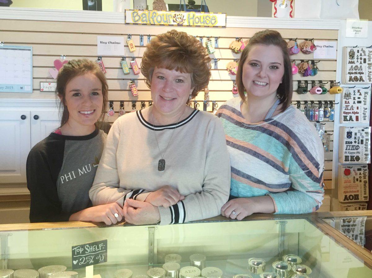 Balfour House owner Angela Quint, center, stands with her daughter Emily, left, and employee Emily Barras on Feb. 11, 2015, behind the store&#8217;s counter.&#160;&#160;