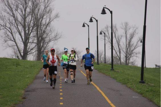 Participants jog on the levee en route to New Orleans during the 2012 Rouge-Orleans marathon.&#160;