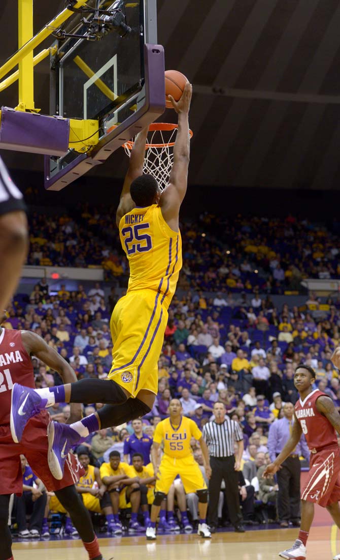 LSU sophomore forward, Jordan Mickey (25), dunks the ball during the Tiger's 71-60 victory against Alabama on Saturday, Feb. 7, 2015, in the Pete Maravich Assembly Center.