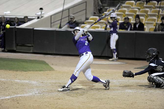 LSU freshman catcher Sahvanna Jaquish (2) slams a 3 run homerun Friday, Feb. 28, 2014 during the Lady Tigers' 8-0 victory against the Lady Harvard Crimson during day one of the Gold and Purple Challenge at Tiger Park.