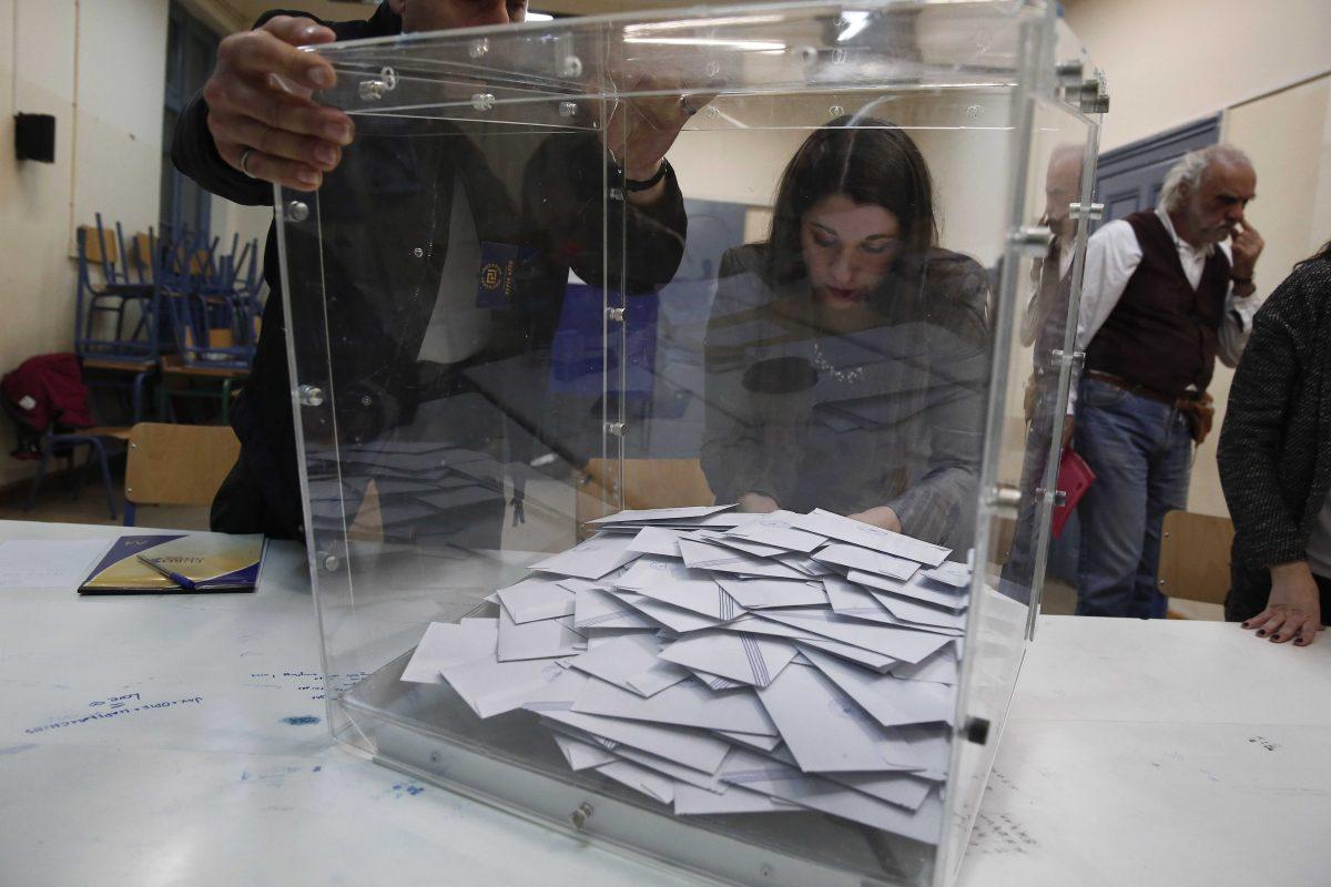 Election officials empty a ballot box to count votes at a polling station, in Athens, on Sunday, Jan. 25, 2015. A Greek state TV exit poll was projecting that anti-bailout party Syriza had won Sunday&#8217;s parliamentary elections _ in a historic first for a radical left wing party in Greece. But it was unclear whether Syriza had won a decisive enough victory over Prime Minister Antonis Samaras&#8217; incumbent conservatives to govern alone. For that, they need a minimum 151 of parliament&#8217;s 300 seats. (AP Photo/Petros Giannakouris)