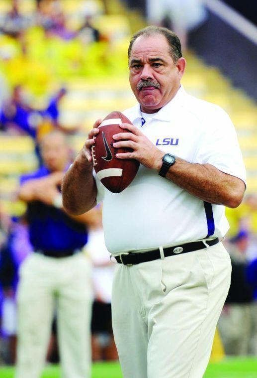 LSU defensive coordinator John Chavis throws a ball during warm-up for the Sept. 29, 2012, game against Towson. Chavis&#8217; defense often ranks among top lines.