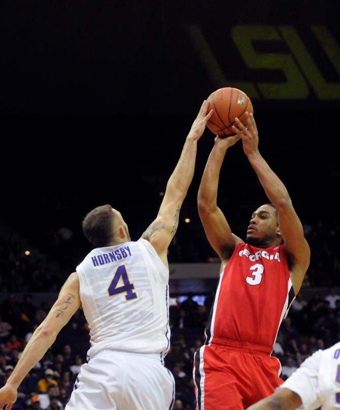 LSU junior guard Keith Hornsby (4) blocks Georgia sophomore guard Juwan Parker (3) in Tigers' win against Georgia Saturday, Dec. 10, 2014 in the Pete Maravich Assembly Center.