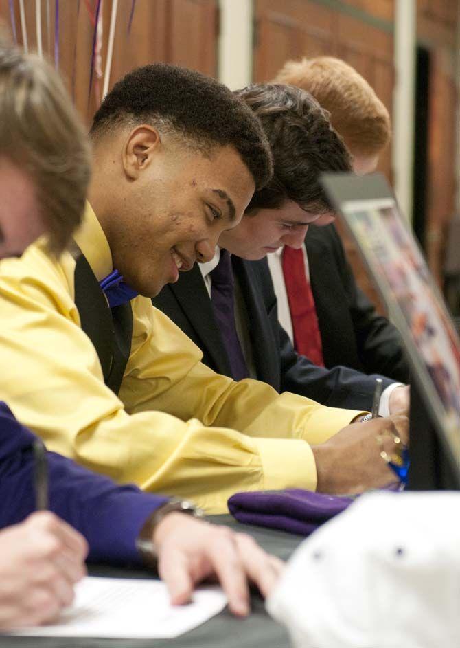 Catholic High School senior running back Derrius Guice signs Wednesday, Feb. 4, 2015, to play football with LSU in the upcoming season.