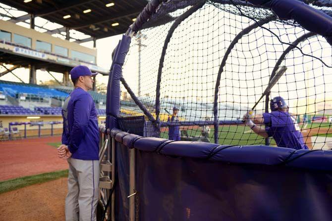 LSU Recruiting Coordinator and Hitting Coach, Andy Cannizaro, watches over players batting Wednesday, Feb. 11, 2015, during team practice.