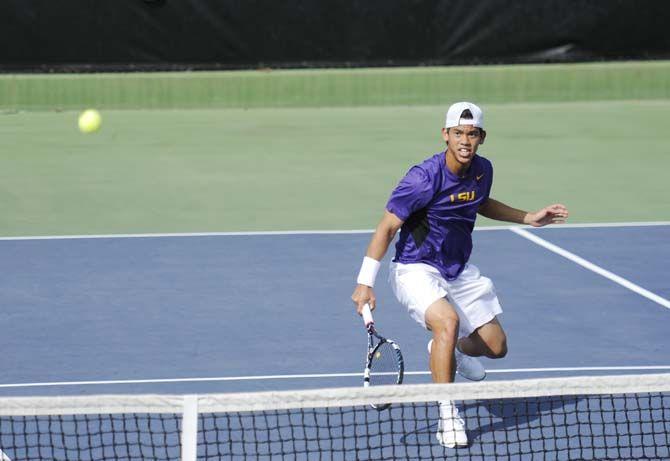 LSU junior Tam Trinh hits the ball Sunday, Feb. 22, 2015 during the Tigers' 4-3 victory against Tulane at the W. T "Robinson Stadium.