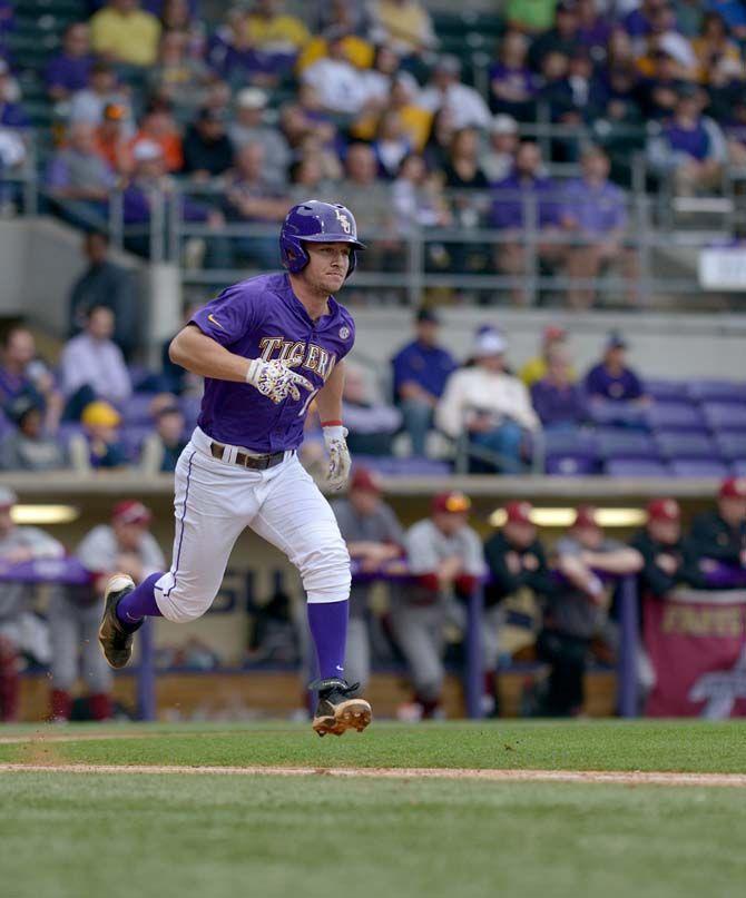 LSU junior infield Alex Bregman (8) runs to first base during the Tigers&#8217; 16-2 victory against Boston College on Saturday, Feb. 21, 2015 in Alex Box Stadium.