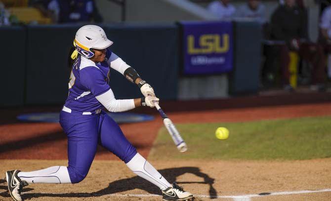 LSU junior infielder Bianka Bell hits a homerun Saturday, March 7, 2015 during the Lady Tigers 6-0 victory againt the Arkansas Razorbacks. Bell officially holds the most homeruns in LSU softball history.