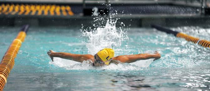 LSU junior Amber Carter participates in the butterfly event on Friday, October 25, 2013 at the LSU vs. Tulane swim meet in the Natatorium.