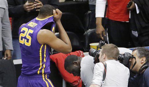 LSU's Jordan Mickey (25) leaves the court after his team lost 66-65 to North Carolina State in an NCAA tournament second round college basketball game, Thursday, March 19, 2015, in Pittsburgh. (AP Photo/Gene J. Puskar)