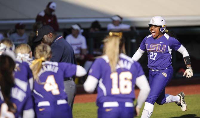 LSU junior infielder Bianka Bell hits a homerun Saturday, March 7, 2015 during the Lady Tigers 6-0 victory againt the Arkansas Razorbacks. Bell officially holds the most homeruns in LSU softball history.