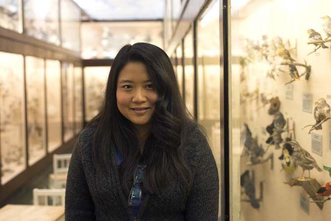 LSU biological sciences Ph.D student Vivien Chua stands in front the bird collection Tuesday, Feb. 24, 2015 inside the Museum of Natural Science.