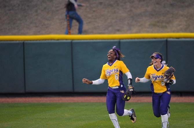 A.J. Andrews and Emily Griggs running in after Andrews makes the winning catch to end the LSU vs. Memphis game on Friday, Feb. 6, 2015, at Tiger Park.