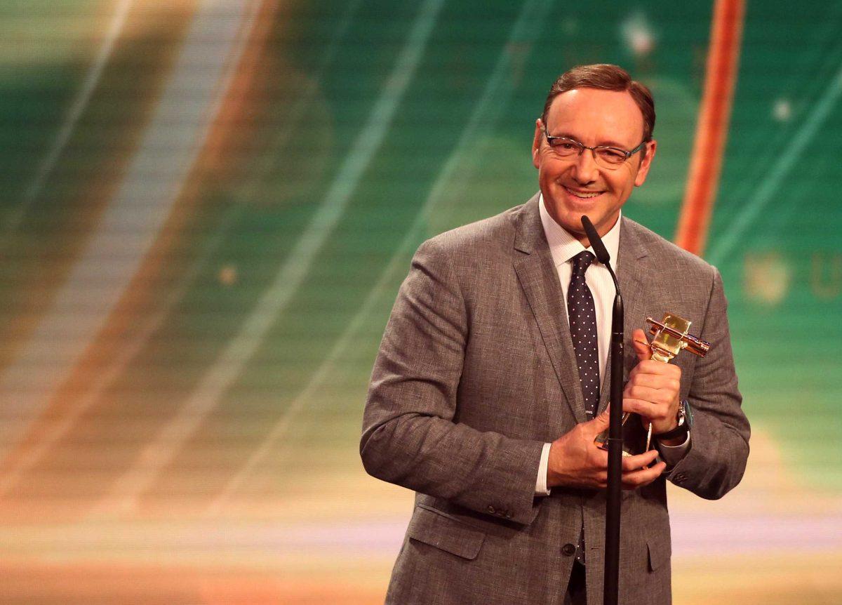 US actor Kevin Spacey holds a Golden Camera award as best international actor during the awarding ceremony in Hamburg, northern Germany, Friday, Feb. 27, 2015. (AP Photo/Christian Charisius, pool)