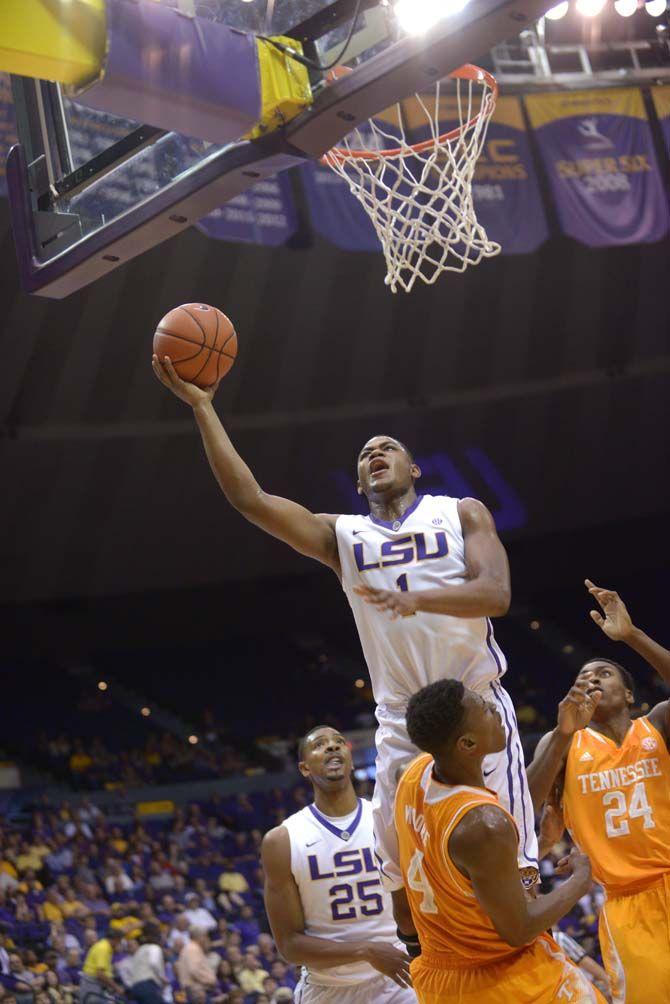 LSU sophomore forward Jarell Martin (1) attempts a lay up over Tennessee junior forward Armani Moore (4) during the Tiger's game against Tennessee on Wednesday, March 4, 2015. at the Pete Maravich Assembly Center.