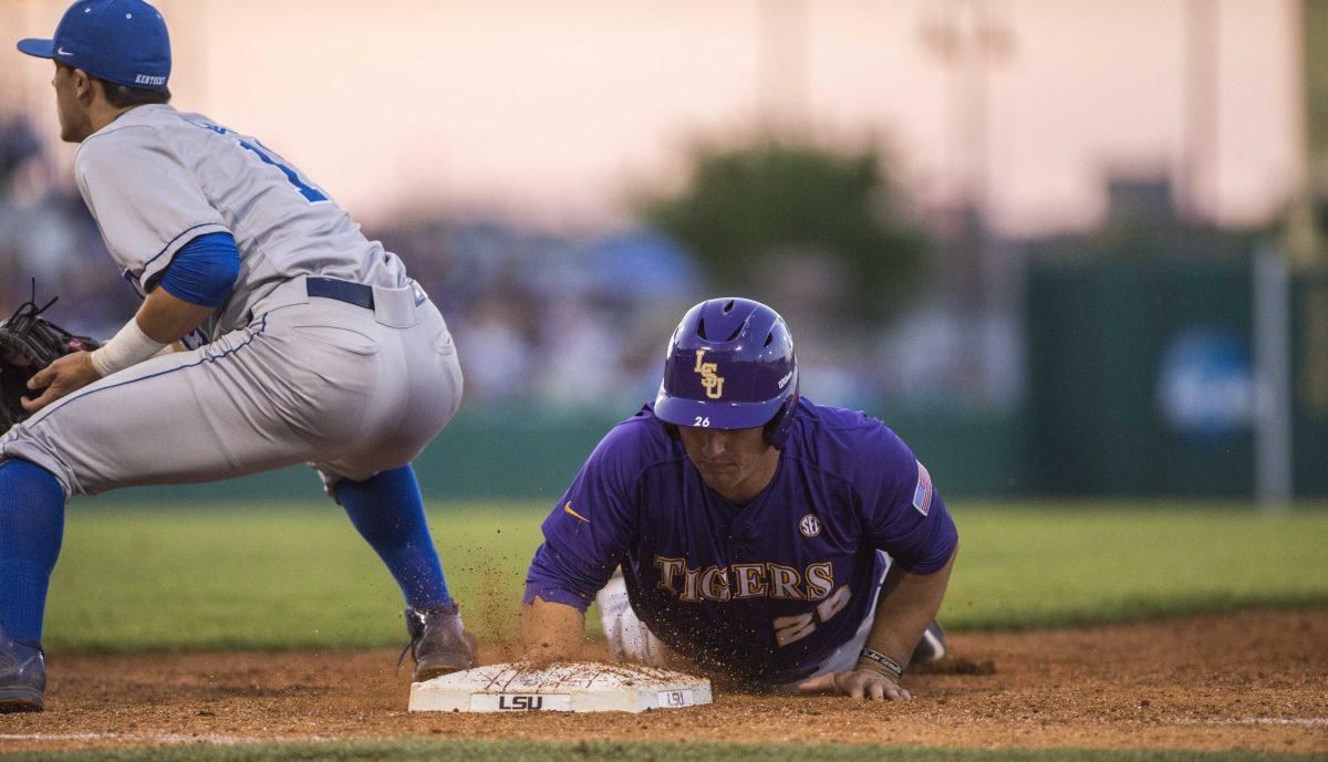 LSU Chris Chinea (26) slides back to first base during the Tigers' 7-3 victory against Kentucky on Saturday, March 28, 2015 in the Alex Box Stadium.