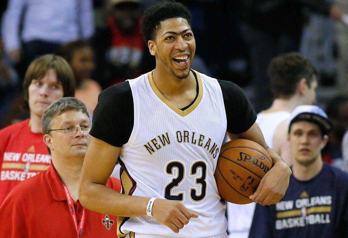 New Orleans Pelicans forward Anthony Davis (23) celebrates after a 95-89 win over the Memphis Grizzlies in an NBA basketball game, Saturday, March. 7, 2015, in New Orleans. (AP Photo/Jonathan Bachman)