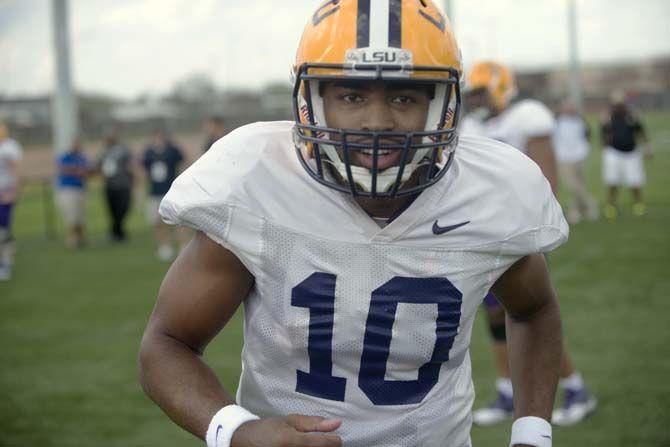 LSU junior quarterback Anthony Jennings (10) runs during practice on Thursday, March 19, 2015 in Charls McClendon Practice Facility