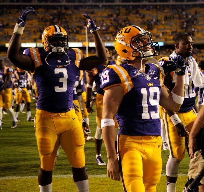 LSU freshman line backer Clifton Garrett (3) and senior defensive back Luke Boyd (19) celebrate 31-0 victory against ULM Saturday, Sep. 13, 2014 in Tiger Stadium.