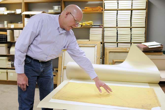 University Archivist Barry Cowan looks at a map of LSU campus Monday, Mar. 2, 2015, in his office in Memorial Hill Library.