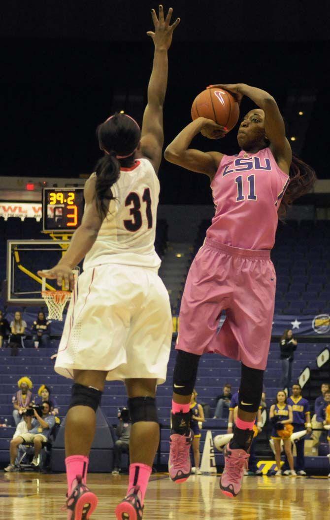 LSU sophomore, guard Raigyne Moncrief (11) shoots a three-pointer during the Tigers&#8217; 64-52 victory against Georgia on Thursday, Feb. 19, 2015 at the Pete Maravich assembly center.