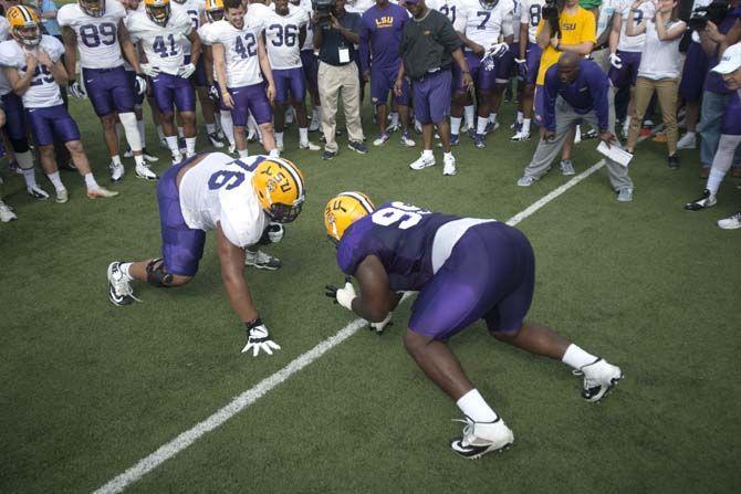 LSU junior offensive line Josh Boutte (76) and sophomore deffensive tackle Greg Gilmore (99) get ready to perform in the big cat drill during practice on Thursday, March 19, 2015 in Charls McClendon Practice Facility