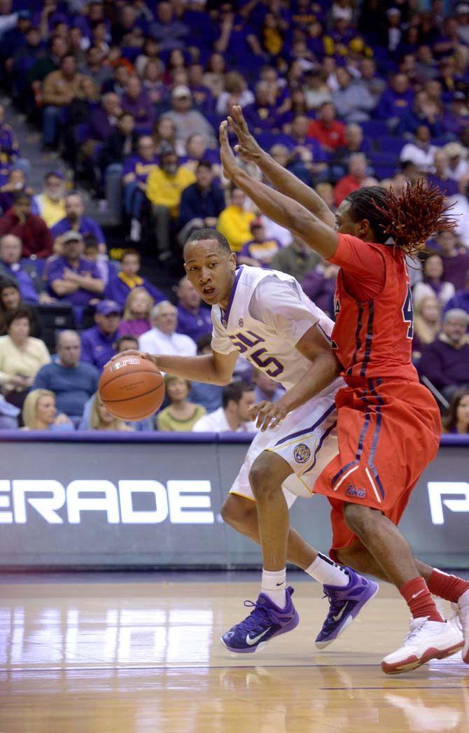 LSU sophomore guard Tim Quarterman (55) moves the ball on the court Saturday, Feb. 28, 2015 during the Tigers' 73-63 victory against Ole Miss in the Pete Maravich Assembly Center.