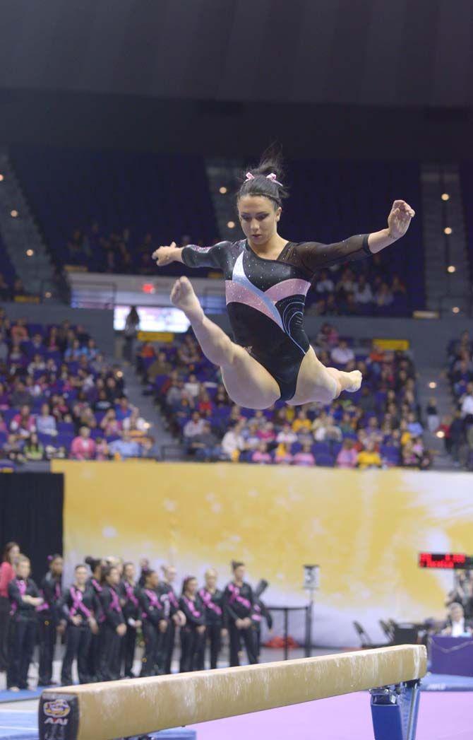 LSU senior all-arounder Rheagan Courville performs her rutine during the Tigers' 198.075-196.850 victory against No. 9 Georgia on Friday, Feb. 6, 2015. in the PMAC.