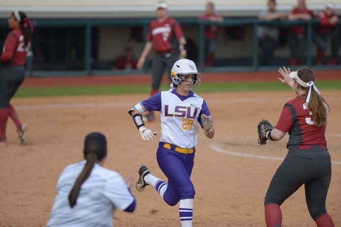 LSU sophomore outfielder Bailey Landry (26) makes it to first base safely on Sunday March 8, 2015 during the Lady Tigers' 7-1 victory against the Arkansas Razorbacks.