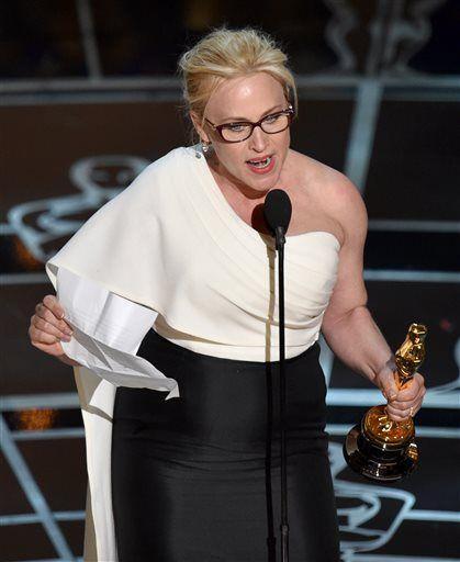 Patricia Arquette accepts the award for best actress in a supporting role for &#8220;Boyhood&#8221; at the Oscars on Sunday, Feb. 22, 2015, at the Dolby Theatre in Los Angeles. (Photo by John Shearer/Invision/AP)