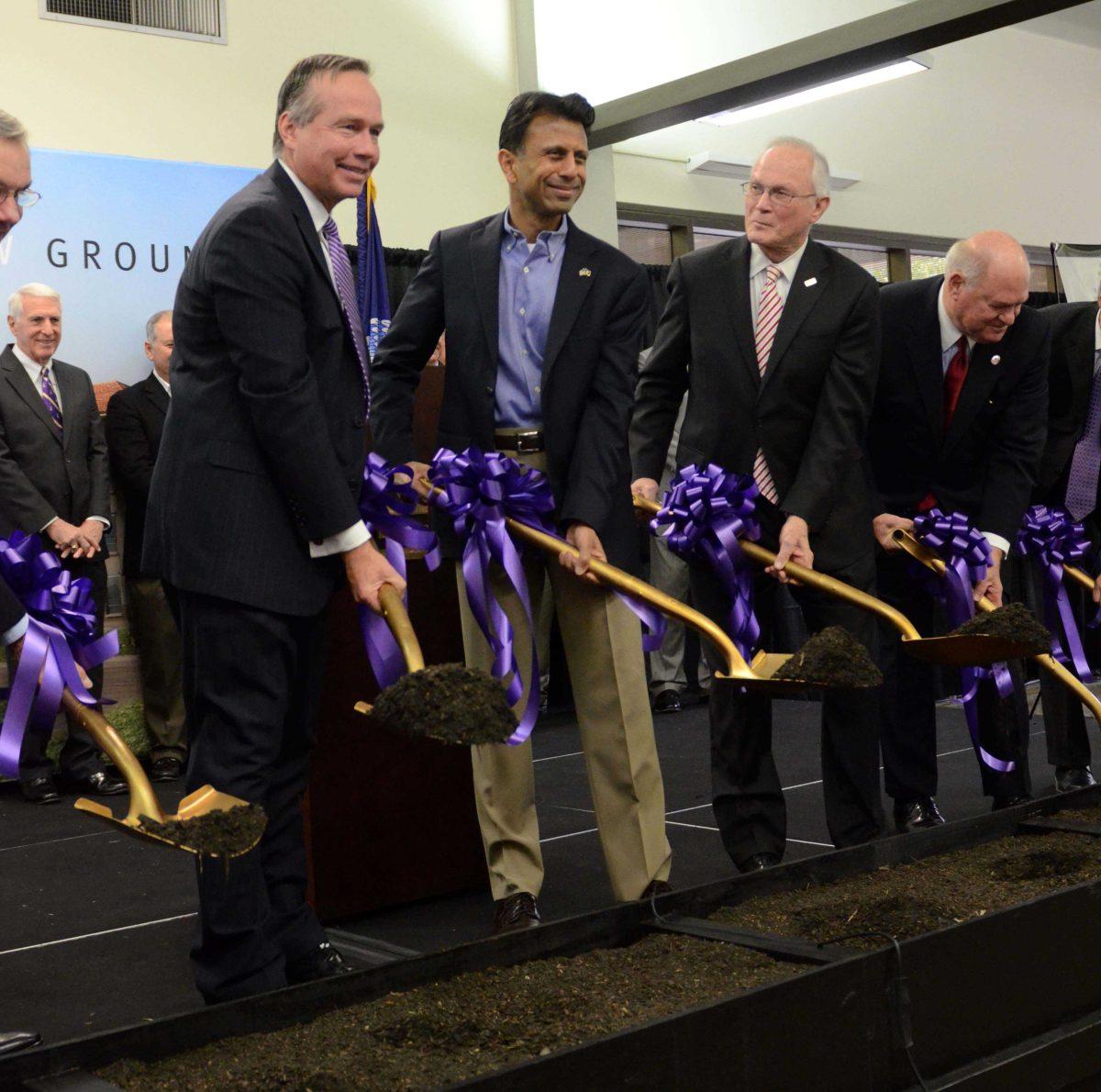 LSU President (left), Governor Bobby Jindal (middle) and other contributors (right) to the Patrick F. Taylor renovations participate in the breaking ground ceremony on November 17, 2014.