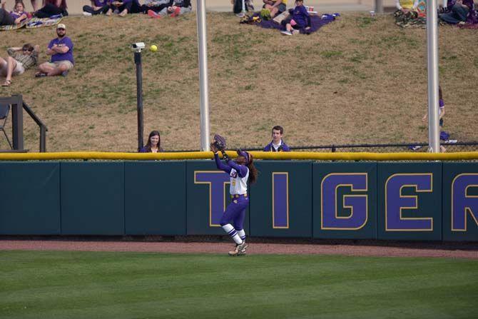 LSU senior outfielder A.J. Andrews (6) catches a fly ball on Sunday March 8, 2015 during the Lady Tigers' record breaking 7-1 victory against the Arkansas Razorbacks.