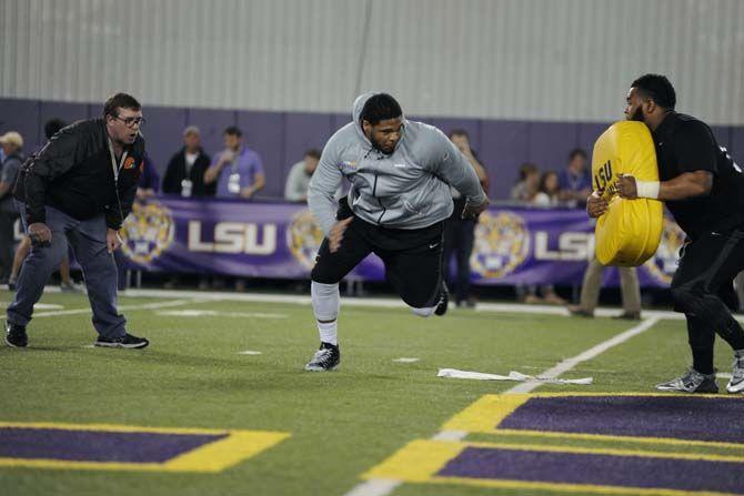 LSU offensive lineman La'el Collins (70) runs a drill on Friday, Mar. 27 2015 on LSU football Pro Day at the football operations indoor facility.