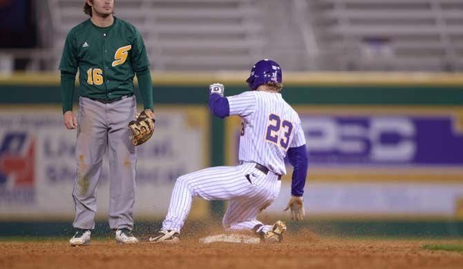 LSU Sophomore Jake Fraley (23) slides to the first base on the 9-8 victory against Southeastern on Thursday, Feb. 26, 2015 in the Alex Box Stadium.