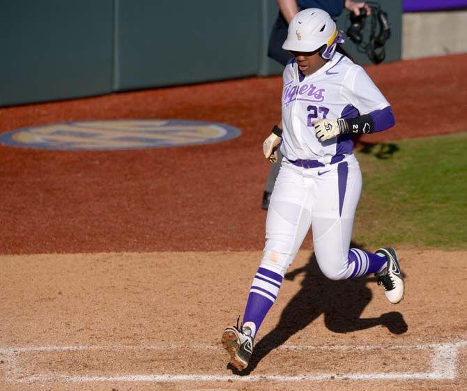 LSU junior infield Bianka Bell (27) runs home on Saturday, Feb. 7, 2015 during the Tiger' 10-0 victory against Tennessee State in Tiger Park.