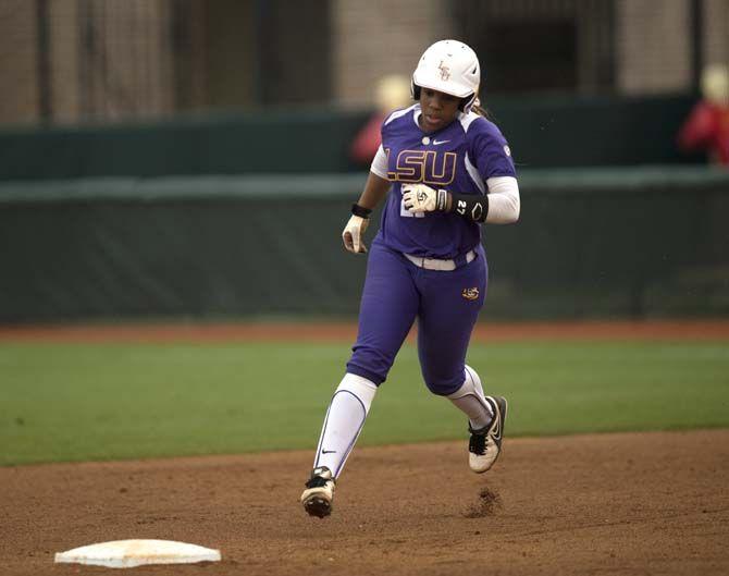 LSU junior infield Bianka Bell (27) runs through second base after hitting a home run during the Tigers' 10-2 victory against Oklahoma Saturday, March 21, 2015 in Tiger Park.