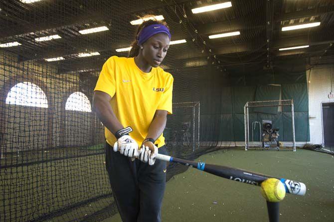 LSU senior outfield A.J. Andrews (6) demostrates the slapping technique on Tuesday, Feb. 10, 2015 at the Tiger Park