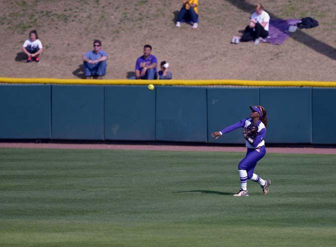 LSU senior outfielder A.J. Andrews (6) throws a ball infield after catching a fly ball on Sunday March 8, 2015 during the Lady Tigers' record breaking 7-1 victory against the Arkansas Razorbacks.