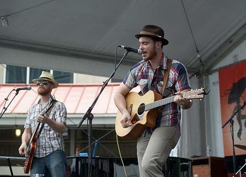 (From left) Brothers Jesse Reaux and Daniel Reaux of the Lafayette band The Rayo Brothers perform Friday, Apr. 24, 2015 at the Lagniappe Stage for the first day of New Orleans Jazz and Heritage Festival.