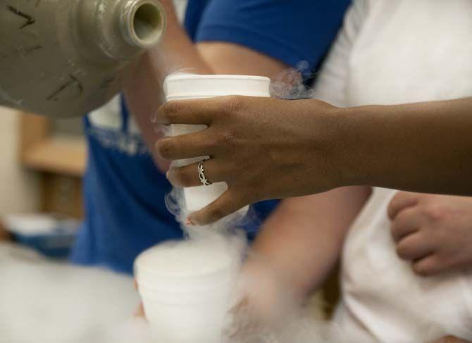 LSU Student Affiliates of the American Chemical Society experiments with liquid nitrogen before their event on the Parade Grounds on Thursday, April, 16, 2015, where they will be raising money for cancer research for Relay for Life by assisting attendees with making their own liquid nitrogen ice cream.